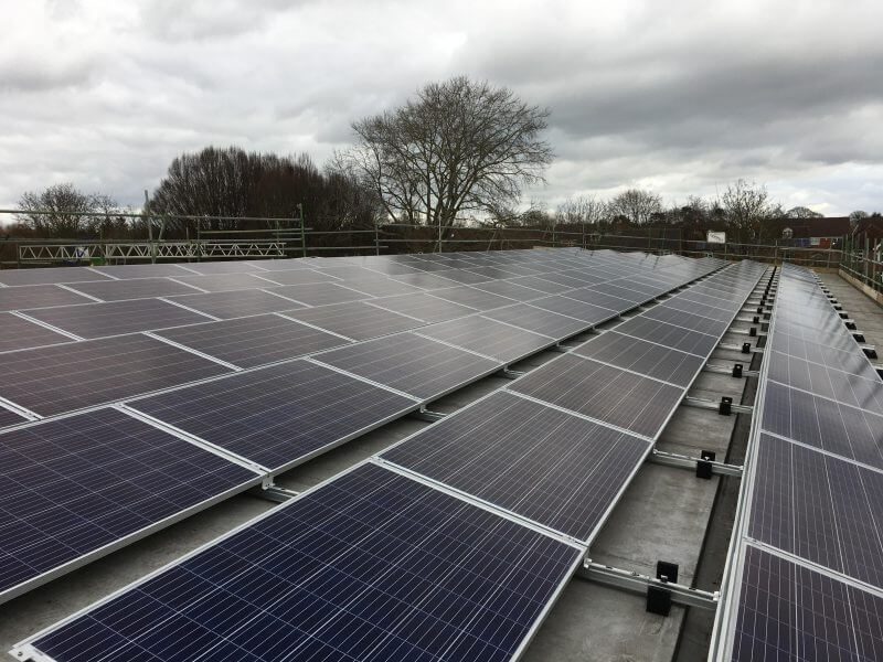 Solar panels on the rooftop of Brookside Primary School, owned and managed by Low Carbon Hub