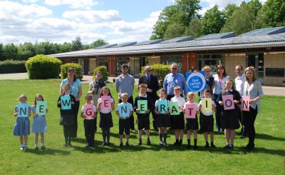 Solar panels on the rooftop of Bure Park School, owned and managed by Low Carbon Hub