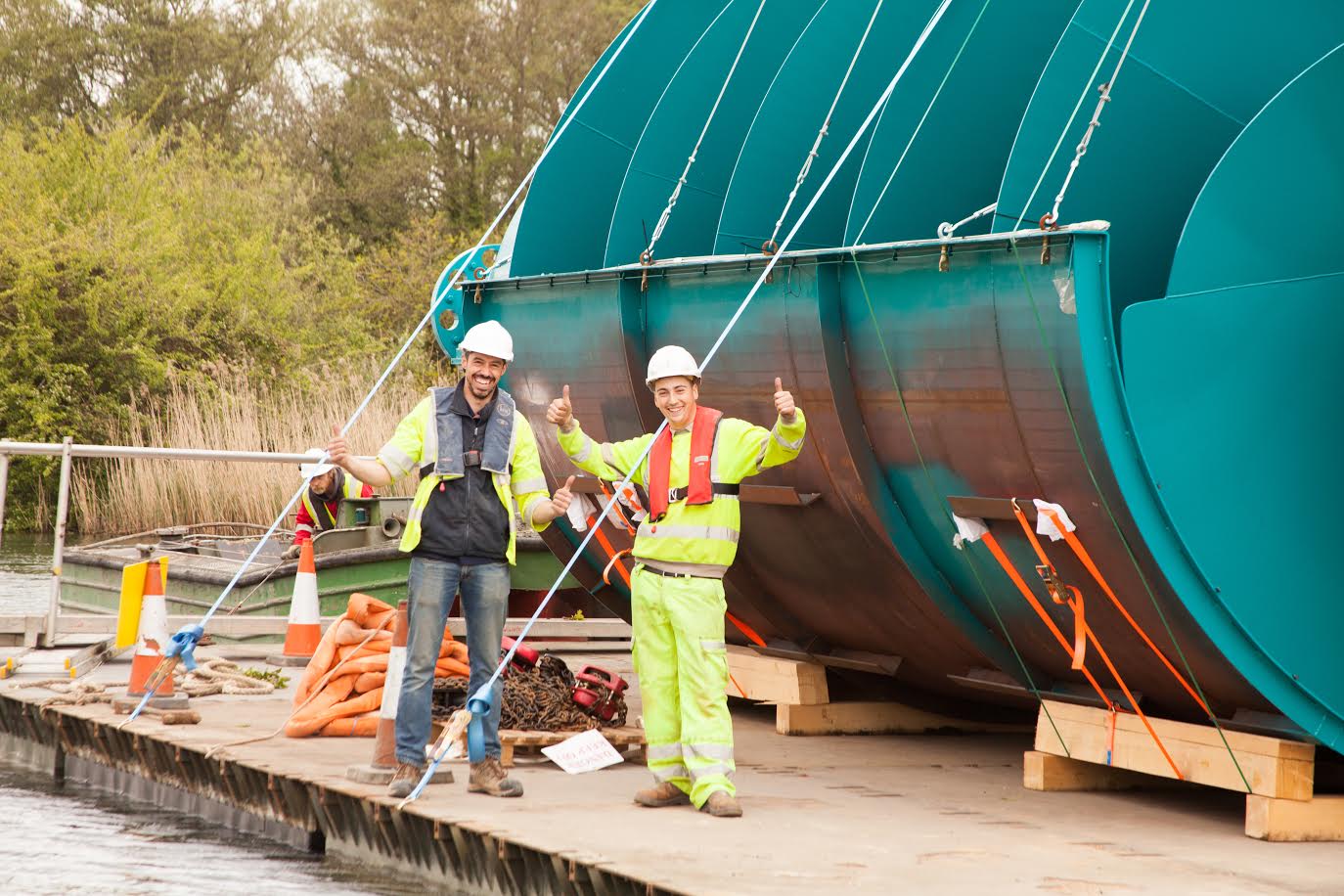 Sandford Hydro construction - the Archimedes screws being floated along the river