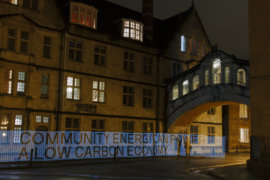 Words made out of light under the Bridge of Sighs in Oxford: Community energy can power a low carbon economy.