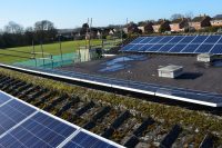 Solar panels on the rooftop of Fir Tree School, owned and managed by Low Carbon Hub