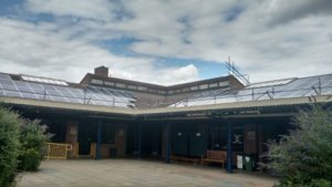 Solar panels on the rooftop of Thomas Reade School, owned and managed by Low Carbon Hub