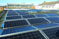 Solar panels on the rooftop of Langtree School, owned and managed by Low Carbon Hub