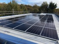 Solar panels on the rooftop of Longfields School, owned and managed by Low Carbon Hub