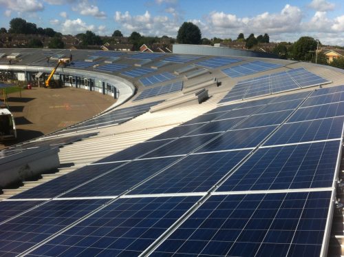Solar panels on the rooftop of Orchard Fields School, owned and managed by Low Carbon Hub