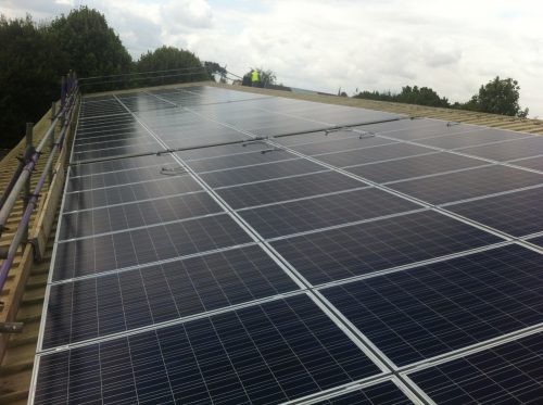 Solar panels on the rooftop of The Warriner School, owned and managed by Low Carbon Hub