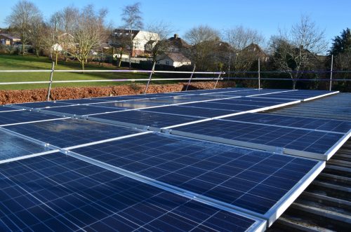 Solar panels on the rooftop of West Kidlington School, owned and managed by Low Carbon Hub
