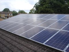 Solar panels on the rooftop of Wheatley Park School, owned and managed by Low Carbon Hub