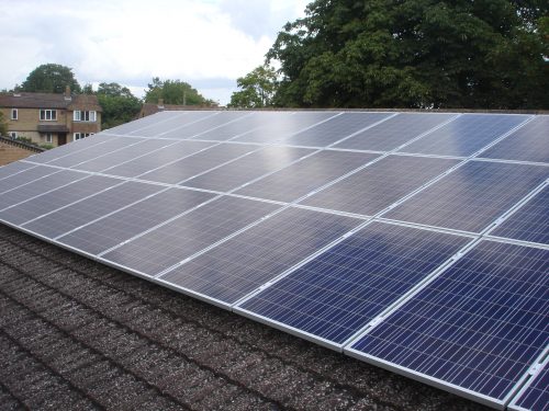 Solar panels on the rooftop of Wheatley Park School, owned and managed by Low Carbon Hub