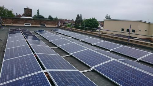 Solar panels on the rooftop of Windmill School, owned and managed by Low Carbon Hub