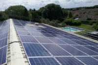 Solar panels on the rooftop of Wood Green School, owned and managed by Low Carbon Hub