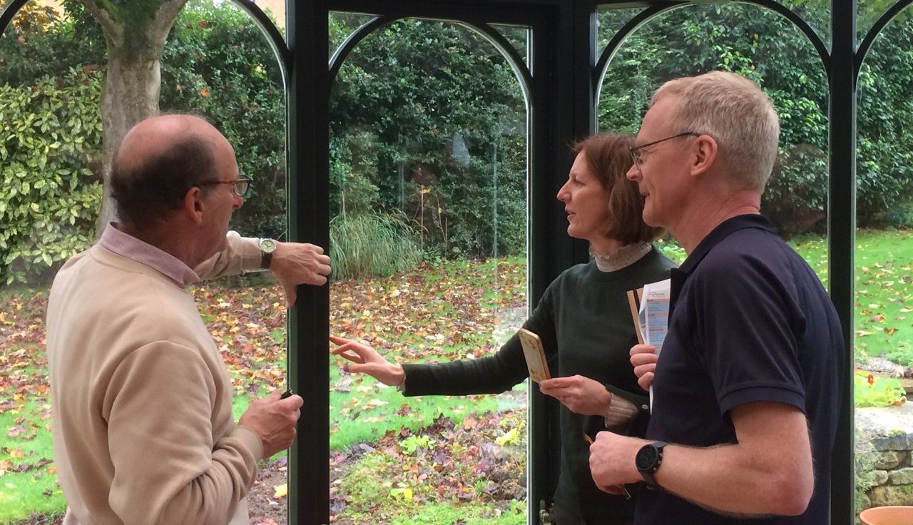Cosy Homes Oxfordshire's retrofit coordinators visit a homeowner, looking at their window glazing
