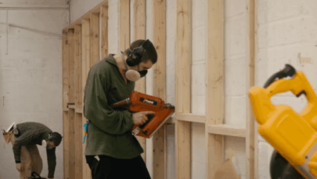 Technicians work on energy assessment recommendations inside a building.