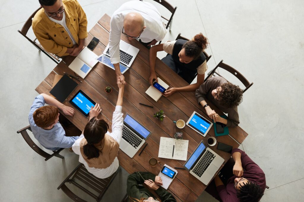 People sitting at desk working in office