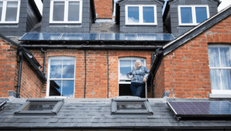 A view of solar panels on the rooftops of houses.
