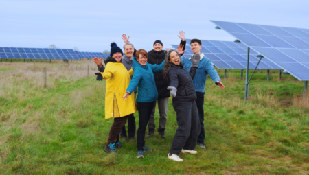 The Low Carbon Hub team celebrate the new solar battery at Ray Valley Solar.